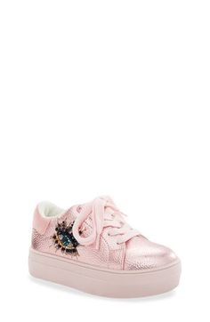 A jewel-embellished eye dazzles the side of a leather platform sneaker designed with a contrast heel in a stylish look your kid is sure to love. Leather upper/synthetic lining/rubber sole Imported Trendy Embellished Sneakers For Streetwear, Pink Embellished Round Toe Sneakers, Pink Kurt Geiger Bag, Pink Embellished Low-top Sneakers, Luxury Pink Low-top Platform Sneakers, Pink Low-top Platform Sneakers With Cushioned Footbed, Kurt Geiger Sneakers, Pink Low-top Platform Sneakers With Textured Sole, London Kids