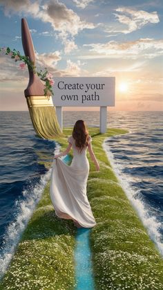 a woman in a white dress is walking on the edge of a boat with a sign that says create your own path