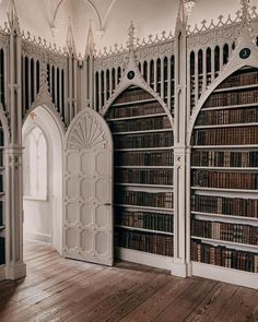 an empty room with many bookshelves in it