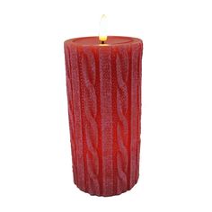 a red candle that is on a white background