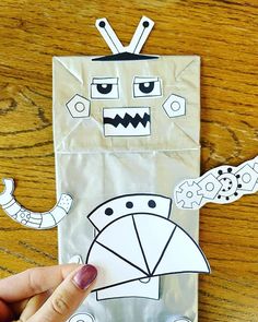 someone is making a paper bag that looks like a robot