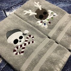 two towels with skulls and hats on them