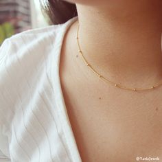 "Our satellite necklace is the perfect layering necklace that will complement everything. Dainty gold choker necklace. Perfect to wear alone or for layering with more necklaces. Feel free to contact me for details & options. Available also in silver: ♥https://www.etsy.com/il-en/listing/642368515/sterling-silver-ball-chain-necklace D e t a i l s: 14K Gold-filled satellite chain. Gold filled spring clasp and links ⊹ L e n g t h At checkout, please pick your desired length Length in the picture Minimalist Gold Choker With Satellite Chain, Dainty Gold Choker With Satellite Chain, Trendy Gold Choker With Tiny Beads, Delicate Gold Choker With Tiny Beads, Delicate Wedding Necklace, Satellite Necklace, Dainty Choker Necklace, Bamboo Hoop Earrings, Delicate Wedding