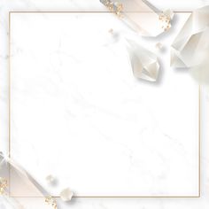 a white marble background with gold accents and a square frame on the bottom that is surrounded by smaller pieces of paper