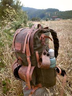 100% waxed canvas and genuine leather are used. The fabric is quite thick and, because it is waxed, it is extremely water resistant. Features Material: 100% cotton, water resistant waxed canvas and Genuine Leather Wide and deep flasks on the right and left 550 Lb parachute rope as tension straps on the flask Leather hanger for hanging knives and axes on both sides Two front pockets Axe hanger with buckle between front pockets Foam padded shoulder straps and back Hip Belt: By giving some of the weight from the shoulders to the hip bone, it prevents the shoulders from getting sore in a short time and provides a more comfortable walk.  At the top and bottom of the bag, there is a perlon hanger for hanging mats, tents, tarps, wool blankets, etc. Options : 30,40,50,60,70,80 Liters WHO WE ARE & Rugged Waxed Canvas Bag For Outdoor Activities, Rugged Bag With Waxed Finish For Outdoor Activities, Brown Waxed Adventure Bags, Brown Adventure Bag With Waxed Finish, Brown Waxed Finish Bag For Adventure, Brown Waxed Finish Bag For Outdoor Activities, Brown Waxed Finish Bags For Adventure, Brown Waxed Finish Bags For Outdoor Activities, Leather Bags With Canvas Lining For Outdoor Activities