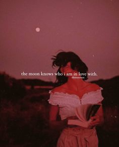 a woman standing in front of a pink sky with the words moon by soul, heart has the warmth of the sun