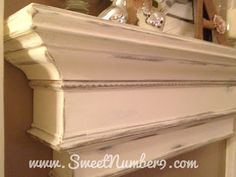 an old fireplace mantel is painted white