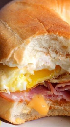 a ham, egg and cheese sandwich on a plate