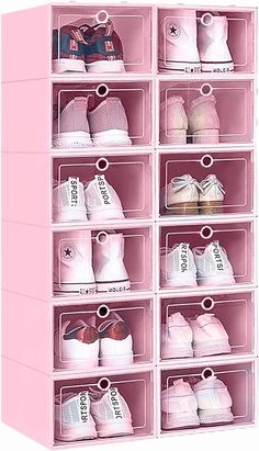 a pink shelf filled with lots of baby shoes