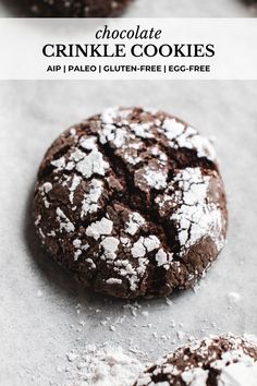 chocolate crinkle cookies with powdered sugar on top and in the foreground