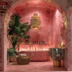 a bathroom with pink tiles and plants in it