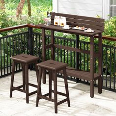 two brown stools sitting on top of a wooden table