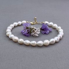 ✦This lightweight and easy to wear bracelet has a strand of white baroque shaped freshwater pearls strung on sturdy beading wire. The pearls have a slightly irregular shape and measure approximately 6mm x 7mm   ✦The bracelet closes with a sturdy lobster clasp and section of large link chain to allow for adjustment in length. Bracelet length is available in 4 lengths: Small 6 to 7", Medium 7 to 8", and Large 8 to 9", or custom length (up to 9").  ✦Comes in your choice of 14k gold filled or sterling silver components. ✦Your jewelry will be packaged in a beautiful and reusable organza bag. All items will be placed in the same organza bag. If you need a separate bag for each item, please leave a comment at check out. ✦Giving your purchase as a gift? If you would prefer that prices not be print Diy Jewelry Projects, Jewelry Card, Beading Wire, Jewelry Projects, Baroque Pearls, Pearl Bracelet, Link Chain, Jewelry Supplies, Custom Jewelry