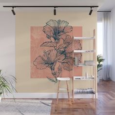 a wall mural with flowers on it in an empty living room, next to a book shelf