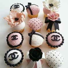 there are many cupcakes decorated with different designs