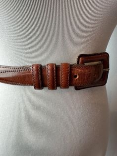 Very nicely made leather belt from the 1990's. Very good quality. Covered leather buckle style. I will say, it has an area with a little specks of imperfections. It's not too distracting. It seems as though the color lifted from a splatter at one time? I still think it's got potential. See all photos.  ✏️✏️✏️DETAILS✏️✏️✏️ Brand: CIPRIANI Size on tag:small  Fits like: X SM- Small Color:  brown Material: leather  Condition: Good (read description/ pics) Item includes: belt ✂ ✂️MEASUREMENTS ✂️✂️ Fi Classic Fitted Belts And Suspenders With Belt Included, Vintage Brown Leather Belt In Retro Style, Vintage Brown Leather Retro Belt, Retro Vintage Brown Leather Belt, Classic Vintage Brown Belt With Antique Buckle, Fitted Leather Belts And Suspenders, Brown Belt With Antique Buckle Classic Style, Brown Classic Belt With Antique Buckle, Classic Brown Belt With Antique Buckle