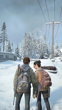 two people standing in the snow with backpacks