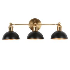 three light bathroom fixture in an antique brass finish with black glass shades and gold accents