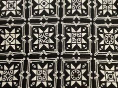 an old black and white crocheted blanket