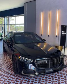 a black car parked in front of a building