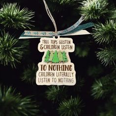 a christmas ornament hanging on a tree with the words, tree tops glisten children listen to nothing children literally listen to nothing