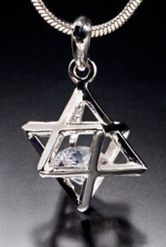 Part of sacred geometry, the Merkaba originates from Egypt and represents Man reaching up to God and God reaching down to Man. It is the vehicle to help get mind, body, and spirit in sync. It is in most major religions and metaphysical thought Merkaba pendant with chain $125.00 Merkaba earrings with leverbacks $150.00 Merkaba earrings with banana clips $150.00 Merkaba earrings with clip-ons $150.00 Mystical Star-shaped Jewelry Gift, Mystical Star-shaped Necklace For Gift, Mystical Star Charm Jewelry Gift, Mystical Star Charm Jewelry For Gift, Mystical Jewelry With Star Charm For Gifts, Star Of David Amulet Jewelry For Gift, Symbolic Star Necklace Gift, Spiritual Star-shaped Jewelry Gift, Spiritual Star-shaped Jewelry For Gifts