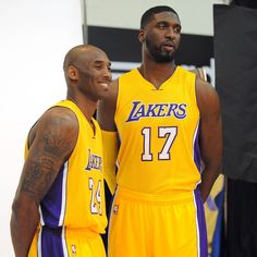 two basketball players standing next to each other