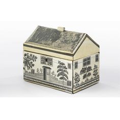 a white and black box with a house on it