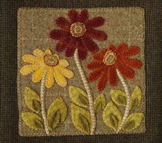 a close up of a patch with flowers on it