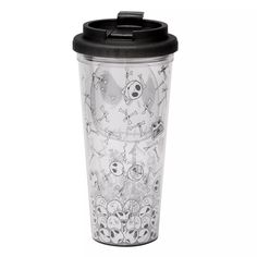 a plastic cup with skulls and bones on the lid is sitting in front of a white background