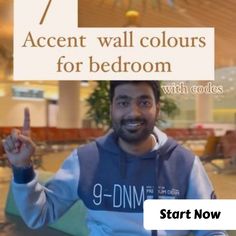 a man holding up a sign that says 7 accent wall colours for bedroom with code