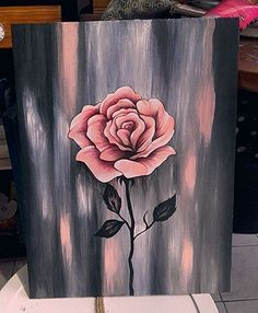 an acrylic painting with a pink rose painted on it's side and the words acrylic painting ideas written below