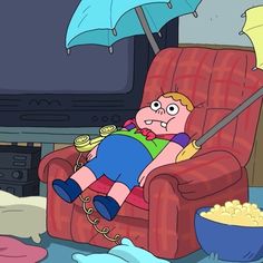 a kid laying on a chair in front of a tv with an umbrella over his head