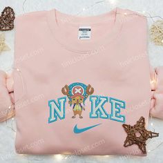 Introducing the Nike x Tony Chopper Anime Embroidered Sweatshirt, a collaboration between Nike and the beloved anime character Tony Chopper. This sweatshirt showcases intricate embroidery of Tony Chopper, adding a touch of playful charm to your wardrobe. The Nike Inspired Embroidered Hoodie brings together the world of sports and anime, creating a unique and stylish piece. The hoodie features a bold Nike logo and vibrant embroidery inspired by popular anime, making it a must-have for any anime e Jorgen Von Strangle, Nike Cartoon, Nike Inspired, Maroon Hoodie, Mike Wazowski, Detailed Embroidery, Daisy Duck, Nike Brand, Disney Character