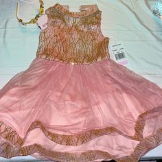 Nwt Formal Little Girls Dress. It Is Pink With Gold Glitter. Such A Beautiful Dress The Pictures Don’t Do It Justice. Purchased As A Flower Girl Dress But My Daughter Outgrew Before The Wedding. Size 6. The Matching Headband Will Be Included. See Pictures. Also See Listing For The Matching Shoes Pink And Gold Dress, Before The Wedding, Matching Shoes, Matching Headband, Flower Girl Dress, Gold Dress, Girls Dress, Girl Dress