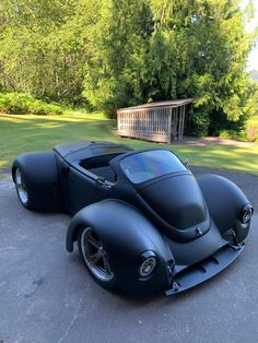 an unusual looking car parked in the driveway