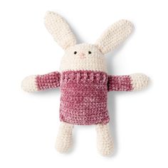 a crocheted stuffed animal wearing a pink shirt and pants with ears sticking out