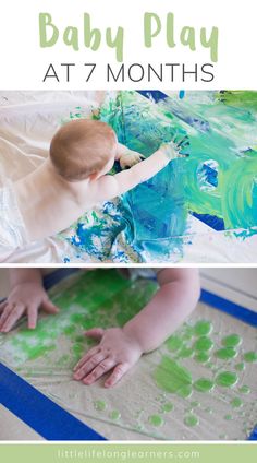 a baby playing with green paint on the floor