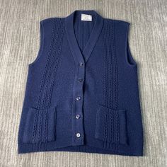 Vintage 80s College Point Two Pocket Ribbed Texture Made in USA Casual Preppy Blue Button Up Sweater Vest Large Mens Condition:  Excellent Used Condition  = No Flaws Measurements: Please see photos above for all measurements IF YOU BUY TWO OR MORE ITEMS USE THE CODE BUNDLE @ CHECK TO SAVE 20% WE SHIP WITHIN 24 HOURS AFTER PURCHASE! Please be aware that we do not offer free returns!! The Buyer is responsible for the cost of the return label.  Follow us on TikTok & Instagram @findsnostalgic and ta Classic Blue Sweater With Pockets, Classic Blue Sweater Vest For Winter, Classic Blue Winter Sweater Vest, Classic Winter Sweater Vest With Button Closure, Vintage Button Sweater Vest For Winter, Vintage Button-up Sweater For Work, Vintage Workwear Sweater With Button Closure, Vintage Sweater With Button Closure For Work, Retro Blue Cardigan With Buttons