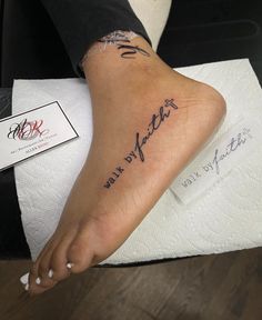 a woman's foot with writing on it and her name written in cursive ink