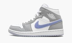 The Women’s Air Jordan 1 Mid “Wolf Grey/Aluminum” is a women’s exclusive look for Michael Jordan’s iconic first signature shoe. Interestingly, the “Wolf Grey/Aluminum” colorway is reminiscent of the white-and-grey color block of the Dior x Air Jordan 1 from 2020, one of the most coveted Air Jordan releases of all time. Like Dior’s high fashion-inflicted take on the retro basketball shoe, the “Wolf Grey/Aluminum” features white leather on the perforated toe, mid-panel, and collar. Contrasting gre Jordan 1 Mid Wolf Grey, Womens Air Jordan 1, Womens Air Jordan, 70s Converse, Nike X Travis Scott, Sneaker Heads, Retro Basketball Shoes, Sporty Fashion, Jordan Shoes Girls