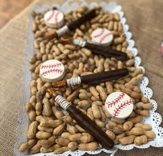 nuts and baseballs are arranged on a lace doily to look like they're ready for the next game