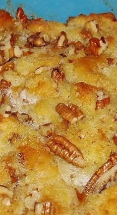 a close up of a casserole dish with pecans on it's toppings