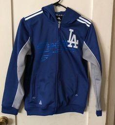 ADIDAS ORIGINALS Dodgers Boys L HOODIE HOODIE TRACK JACKET BLUE Great condition! 20-1/2” chest 23-1/2” back A033 Adidas Blue Outerwear With Three Stripes, Adidas Blue Outerwear With Three Stripes Branding, Varsity Blue Track Jacket For Sports Events, Blue Varsity Track Jacket For Sports Events, Blue Collegiate Track Jacket For Sports Events, Casual Blue Outerwear For Sports Events, Blue Collegiate Track Jacket For College, Adidas Blue Track Jacket With Three Stripes, Varsity Hooded Track Jacket For Sports Events