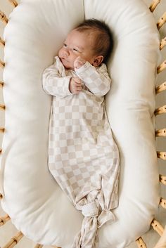 Wrap your little one in the utmost comfort with our Taupe Checkered Bamboo Knot Gown. Crafted from luxurious Bamboo Rayon, this gown is designed to keep your baby cozy and content. The size 0-3 gown features fold-over hand and two snaps for effortless on and off. The bottom can be easily tied and untied in a knot, allowing for quick and hassle-free diaper changes, making it a must-have for newborns. With a range of gender-neutral designs and colors, this gown is perfect for any baby. Match it with our stretch swaddles, head wraps, and hats for a coordinated and stylish look. Dressing your baby has never been easier or more comfortable than with our Taupe Checkered Bamboo Knot Gown.
Wash in cold water
Tumble dry low 
95% Bamboo 5% spandex 
*Excluded from all discounts**Shipping fees may app New Born Must Haves, Neutral Design, Head Wraps, Little One, Cold Water, Gender Neutral, Range, Hats