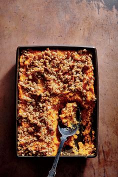 a square casserole dish filled with meat and vegetables