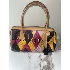 Brand: Dior Color: Multicolor (Pink, Yellow, Black, Purple) Material: Canvas With Leather Trim Pattern: Argyle With Dior Lettering Handles: Dual Rolled Leather Handles Closure: Top Zip Closure Interior: Spacious Compartment With Fabric Lining Dimensions: [Provide Dimensions If Available] Condition: Excellent Condition, Gently Used Includes: Dior Leather Tag This Vibrant Dior Boston Bag Features A Striking Multicolor Argyle Pattern With Bold Dior Lettering. Crafted From Durable Canvas With Luxurious Leather Trim, This Bag Is Perfect For Adding A Pop Of Color To Your Wardrobe. The Spacious Interior And Stylish Design Make It An Ideal Choice For Everyday Use Or Special Occasions. Formal Multicolor Shoulder Bag With Dust Bag, Designer Multicolor Shoulder Bag For Formal Occasions, Designer Formal Multicolor Shoulder Bag, Dior Boston Bag, Argyle Pattern, Leather Tag, Boston Bag, Leather Handles, Leather Trim