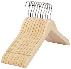 a wooden hanger with five hooks on it