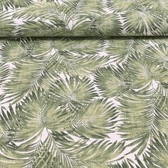 a green and white wallpaper with palm leaf print on it's back side