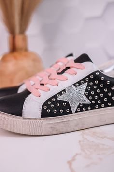 The classic black sneakers are elevated with edgy metal studs and a shiny silver star accent. Bring some sparkle to your step and show off your quirky style with every strut. Fit: True to Size. If you are a 1/2 size or have a wide foot, size up. Brand: Corky's Trendy Silver Platform Sneakers, Casual Lace-up Sneakers With Rivets, Edgy Platform Sneakers With Studded Rubber Outsoles, Edgy Platform Sneakers With Studded Outsoles, Casual Studded Lace-up Sneakers, Trendy Low-top Spiked Sneakers, Punk Low-top Sneakers With Spikes, Casual Low-top Sneakers With Studs, Edgy Sneakers With Studded Rubber Outsoles And Round Toe